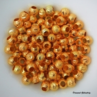 Kovová korálka vyrezávaná zlatá - 8 mm