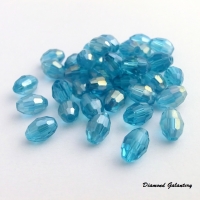 Obrusované korálky 6 x 8 mm - modrá